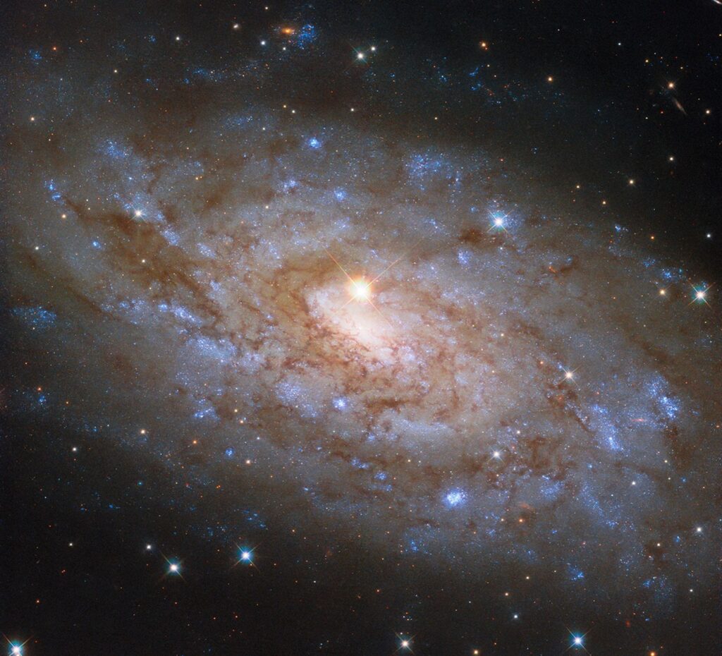 Hubble Space Telescope image is the stunning spiral galaxy NGC 5530. This galaxy is situated 40 million light-years away in the constellation Lupus, the Wolf, and classified as a ‘flocculent’ spiral