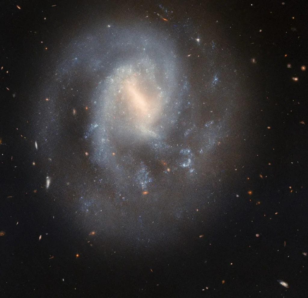 Explore how Hubble captured the IC 758 galaxy supernova and uncovered the stellar explosion of SN 1999bg. Discover its effects on star formation and galaxy evolution.