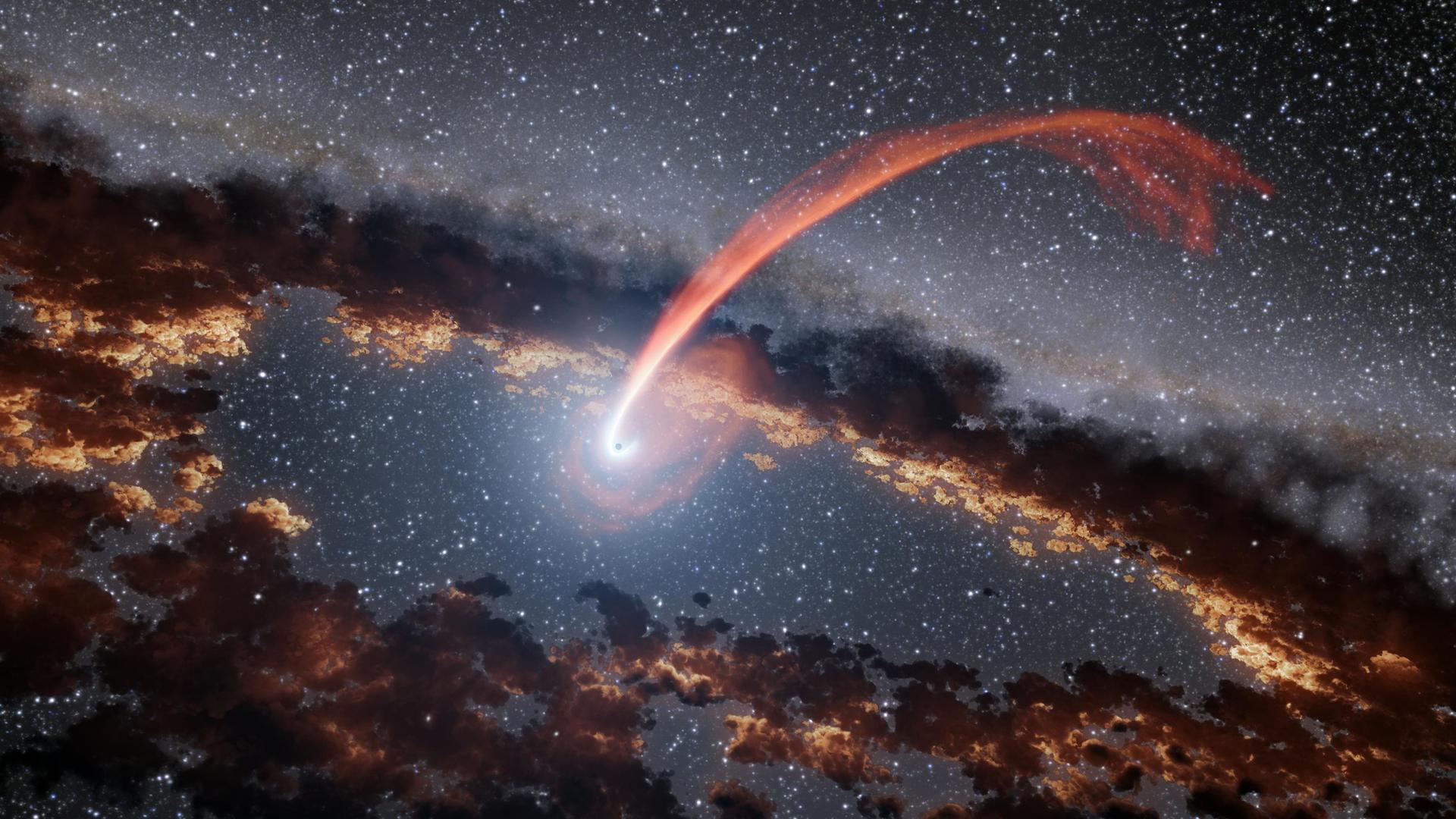 A supermassive black hole sits silently at the center of most galaxies, including our own Milky Way. Though they can be billions of times more massive than the Sun, these cosmic giants are often invisible unless they are actively feeding.
